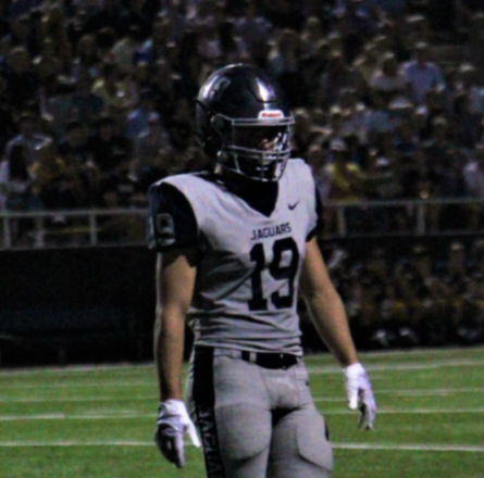 Cade Edlein, a senior captain of the varsity football team, walks toward the sidelines during Friday night’s game against Highland Park. Cade has played football since he was in 7th grade and has worked hard for the past years to get to where he is now. “I’m sad [that] my high school career is ending, but it has been a blast, and I wouldn’t have traded it for anything,” said Edlein.