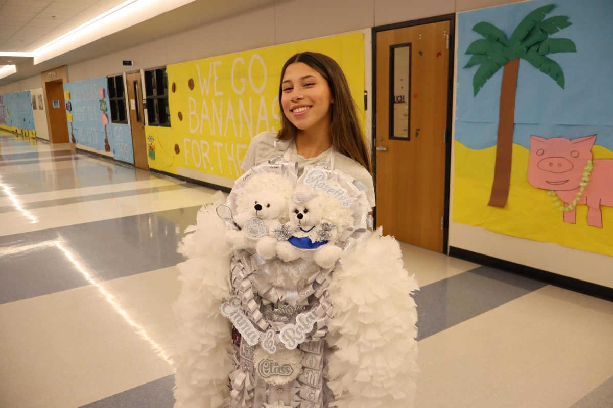 Senior Emma Santos poses with her homecoming mum. 