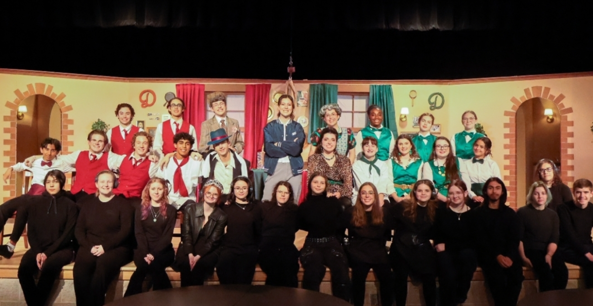 Valeria Punceles, stage manager, (Bottom row, fifth from the left) with the behind the scenes crew and actors.
